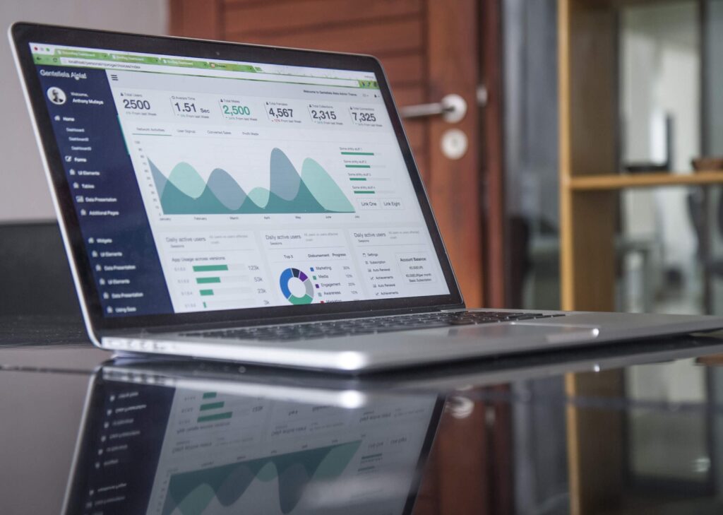 Laptop showing a website analytics dashboard with charts