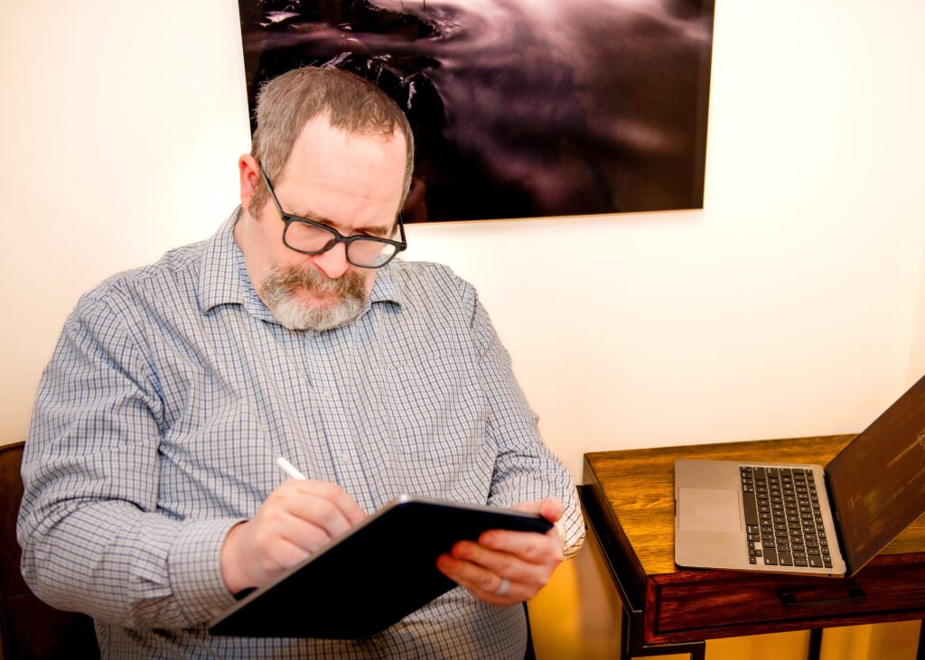 Steve working on a tablet in his office
